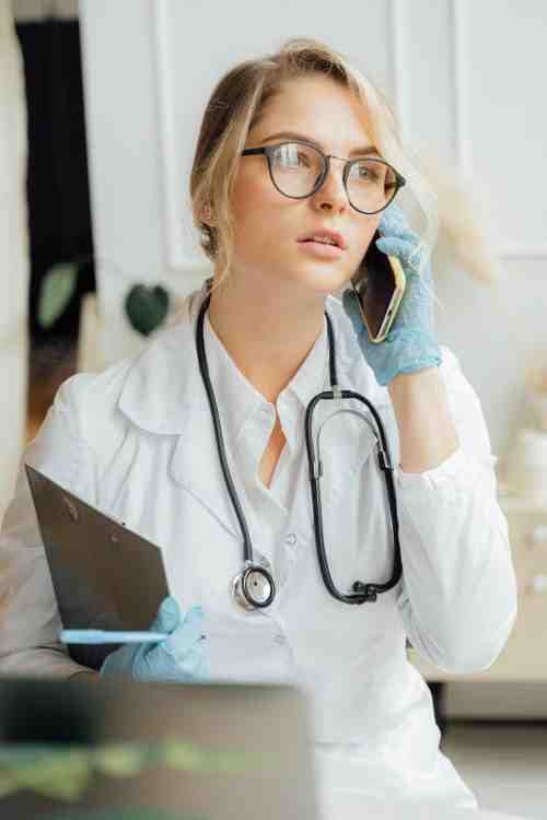 Primary care physician conducting a telehealth consultation over phone and digital platform